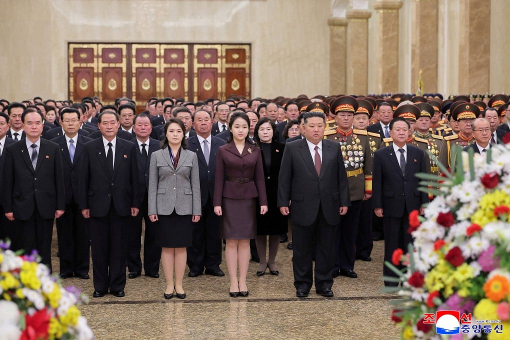 North Korean leader Kim Jong-un, his wife and their daughter (centre) visit the Kumsusan Palace of the Sun in Pyongyang on Thursday. Photo: KCNA via Reuters