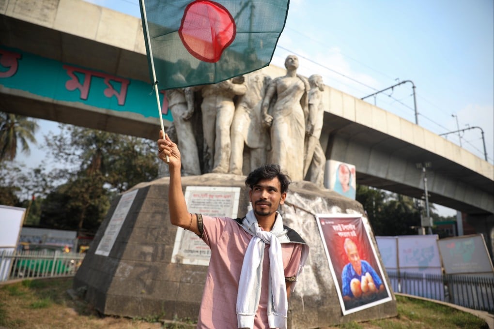 A man holds a Bangladeshi national flag during celebrations to mark Victory Day at the old airport in Sher-e-Bangal Nagar in Dhaka, Bangladesh, on December 16, 2025. Photo: EPA