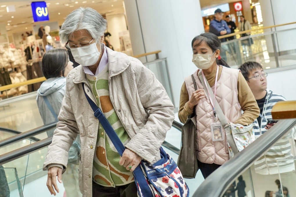 People wear masks inside a shopping centre in Tai Kok Tsui. Photo: Karma Lo