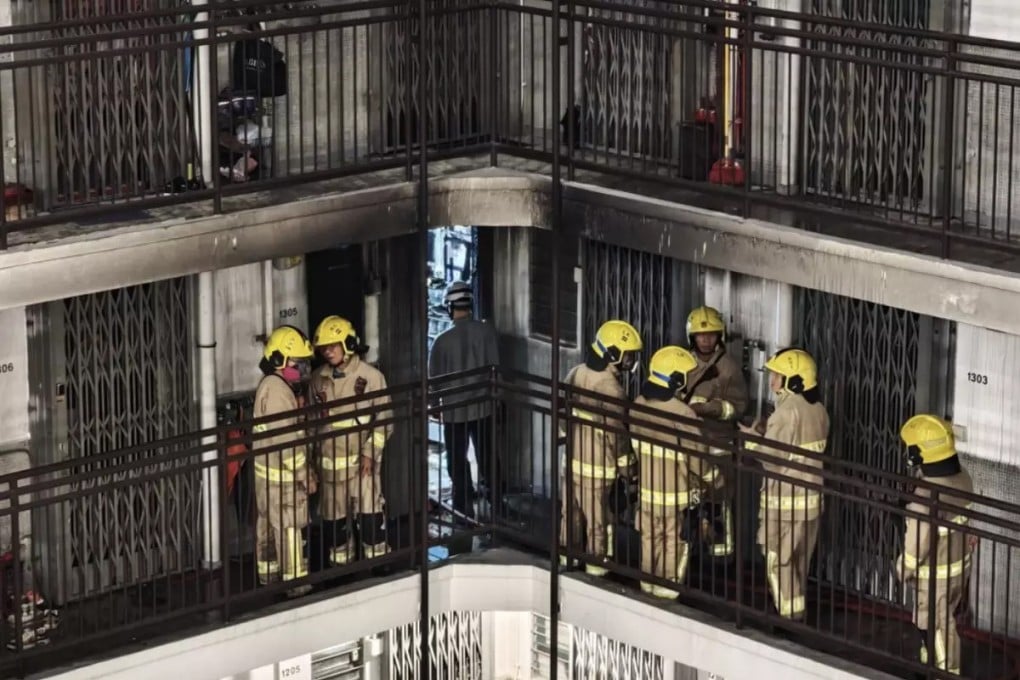 Firefighters at the scene of the blaze in Lai Yiu Estate’s Fu Yiu House on Friday morning. Photo: Handout