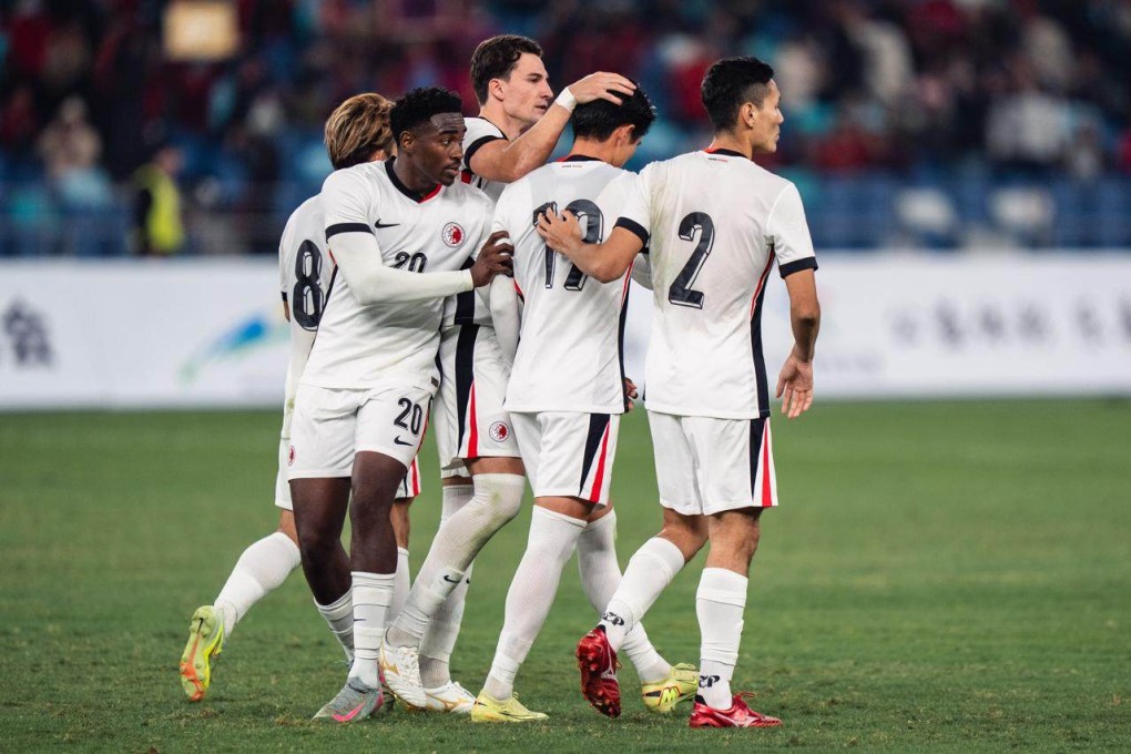 Hong Kong’s Vas Nunez gives Wong Wai a consoling pat on the head after his missed penalty handed Guangdong victory. Photo: HKFA