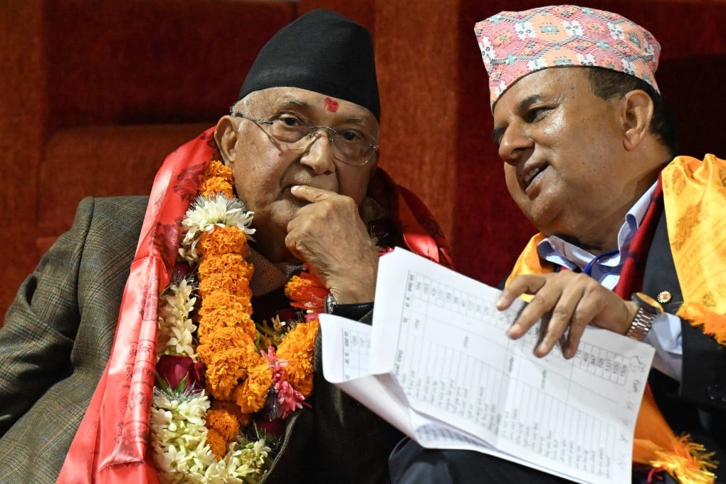 Former Nepali Prime Minister and newly elected leader of the Communist Party of Nepal - Unified Marxist Leninist (CPN-UML), KP Sharma Oli (left) looks on during the party’s 11th general convention in Kathmandu on December 18 last year. Photo: AFP