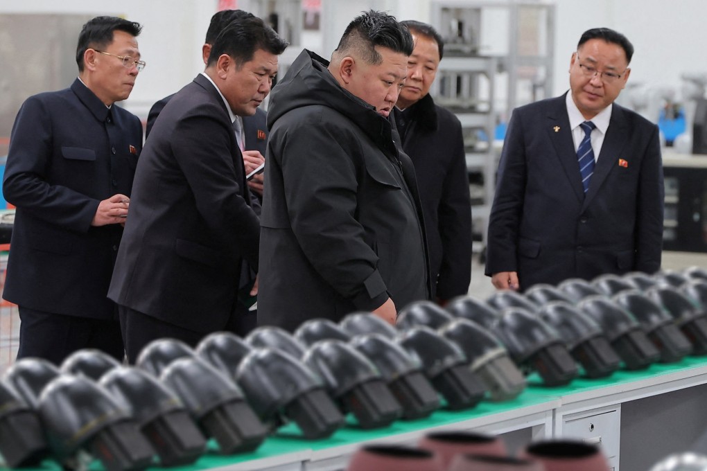 North Korean leader Kim Jong-un (centre) visits a military factory in this photo released on Sunday. Photo: KCNA/Reuters