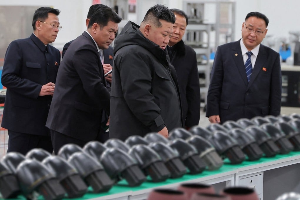 North Korean leader Kim Jong-un (centre) visits a military factory in this photo released on Sunday. Photo: KCNA/Reuters