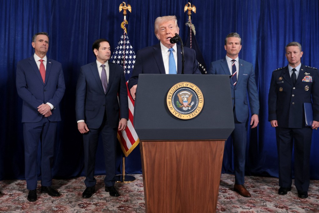 US President Donald Trump, flanked by his top officials, addresses a press conference following the capture of the Venezuelan first couple, in Florida on January 3. Photo: Reuters