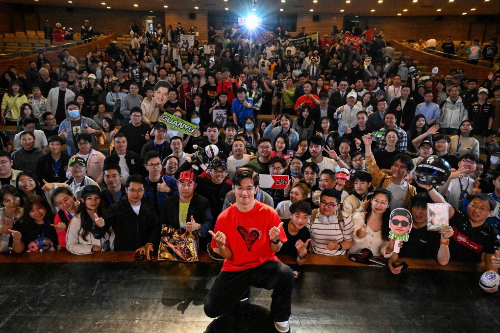 Chinese driver Zhou Guanyu poses for a pictures with his fans after the world premiere of the docu-film The First One, in Shanghai, on April 16, 2024. Photo: AFP