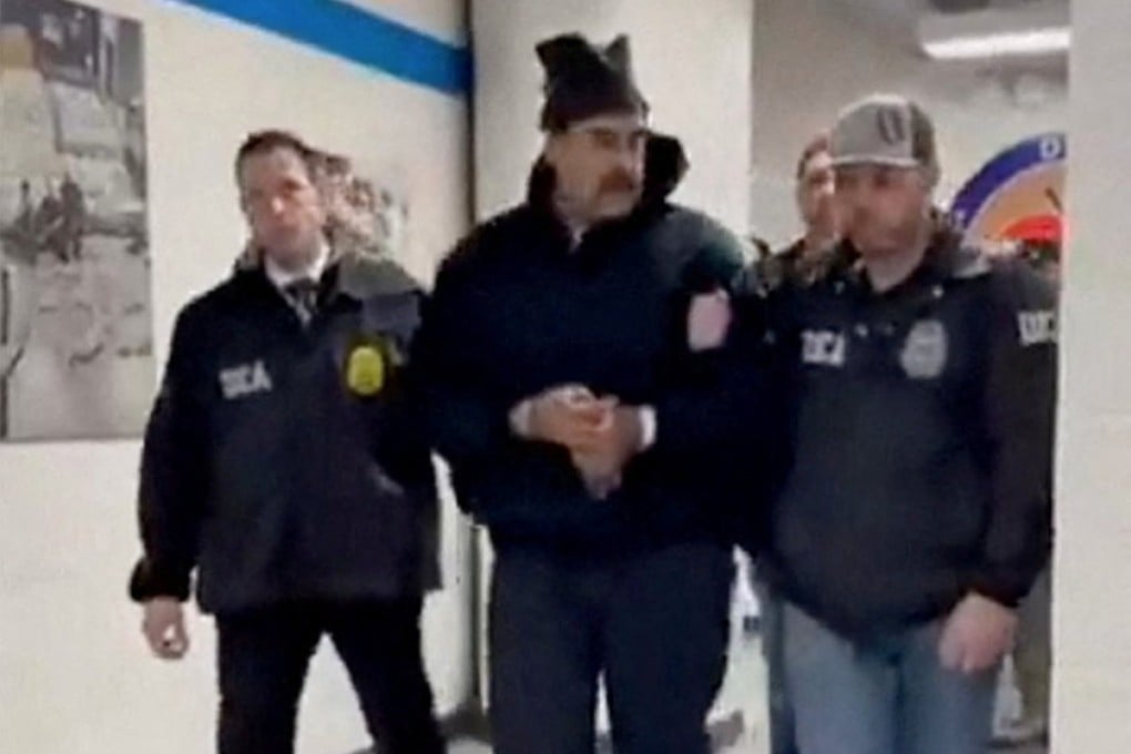 A still image from video posted on social media by a White House team shows Venezuelan President Nicolas Maduro being walked in the offices of the US Drug Enforcement Administration in New York. Photo: via Reuters
