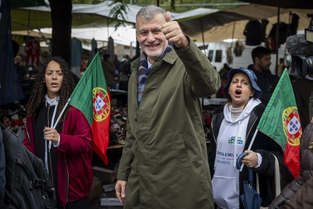 Former head of the navy and candidate for the upcoming 18 January presidential election, Henrique Gouveia e Melo, visits the local Monte Abracao market in Queluz, Sintra, Portugal, on Saturday. Gouveia e Melo rose to national prominence after being appointed coordinator of the Task Force for the successful national COVID-19 vaccination plan that saw Portugal have the highest vaccination rates in the world. Photo: EPA-EFE