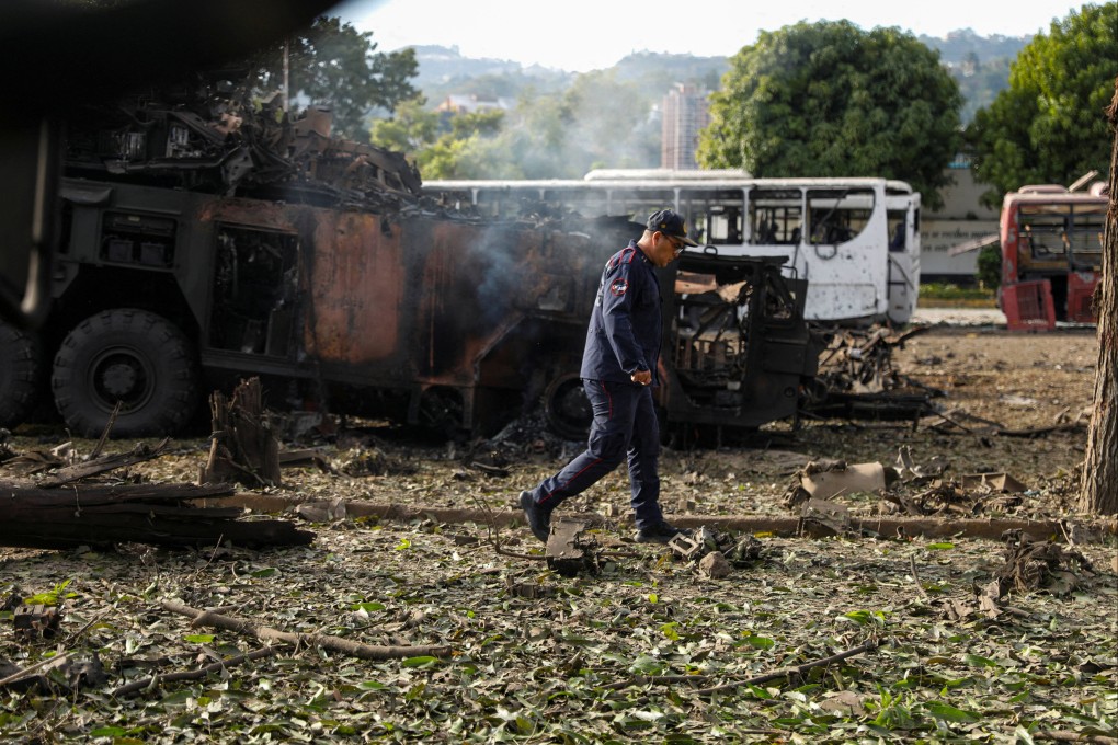 A firefighter walks past a destroyed anti-aircraft unit at La Carlota military base in Caracas following a US strike that captured Venezuelan leader Nicolas Maduro on Saturday. Photo: Reuters