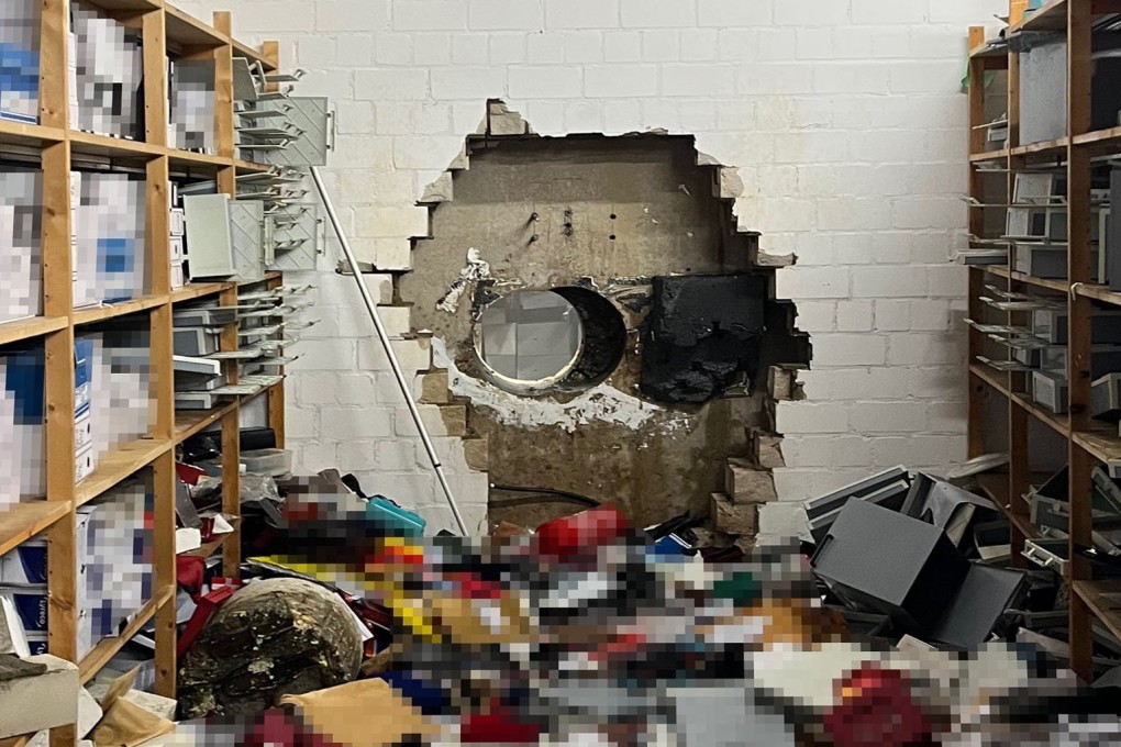 A giant hole in a wall of the vault of a Sparkasse bank branch after thieves broke in. Photo: Police Gelsenkirchen via EPA