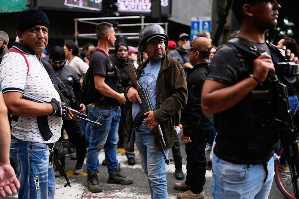 Pro-government, armed civilians attend a protest in Caracas, Venezuela, on January 4, demanding the release of President Nicolas Maduro and first lady Cilia Flores, after US forces captured and flew them to the United States. Photo: AP