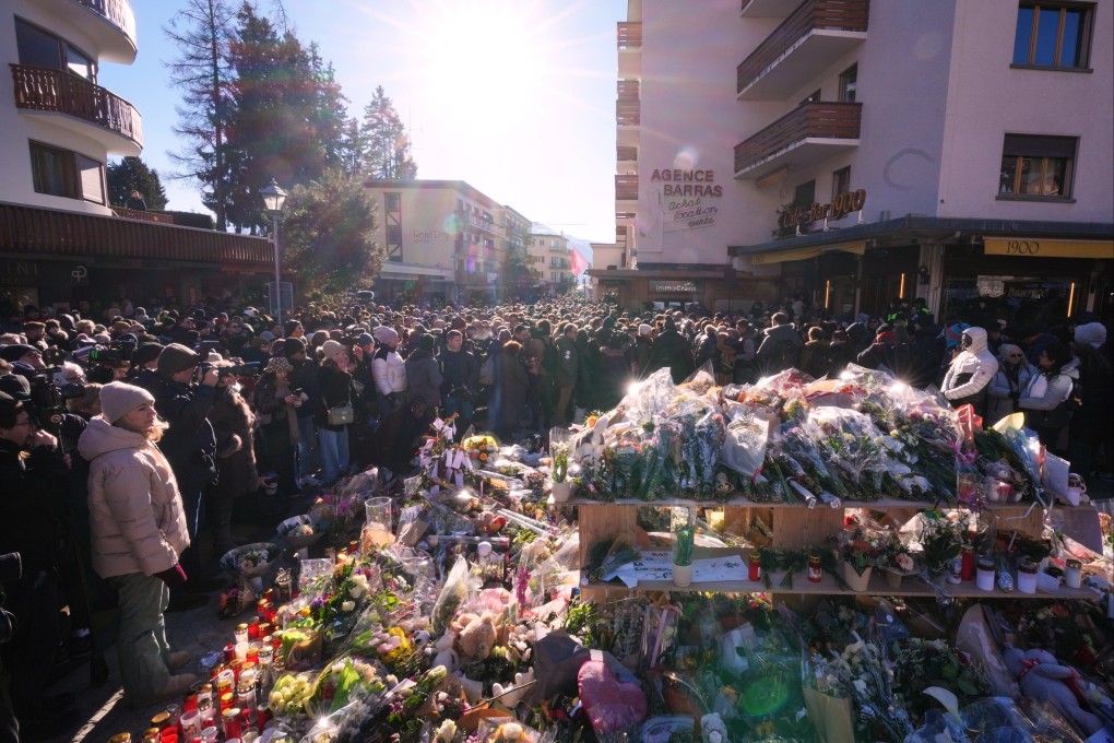 People gather during a memorial procession in Crans-Montana, Switzerland, on Sunday. Photo: AP
