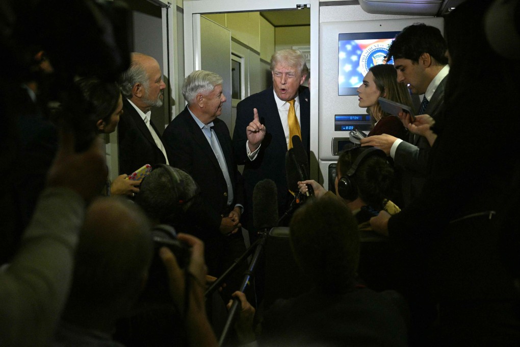 US President Donald Trump speaks with reporters aboard Air Force One. Photo: AFP