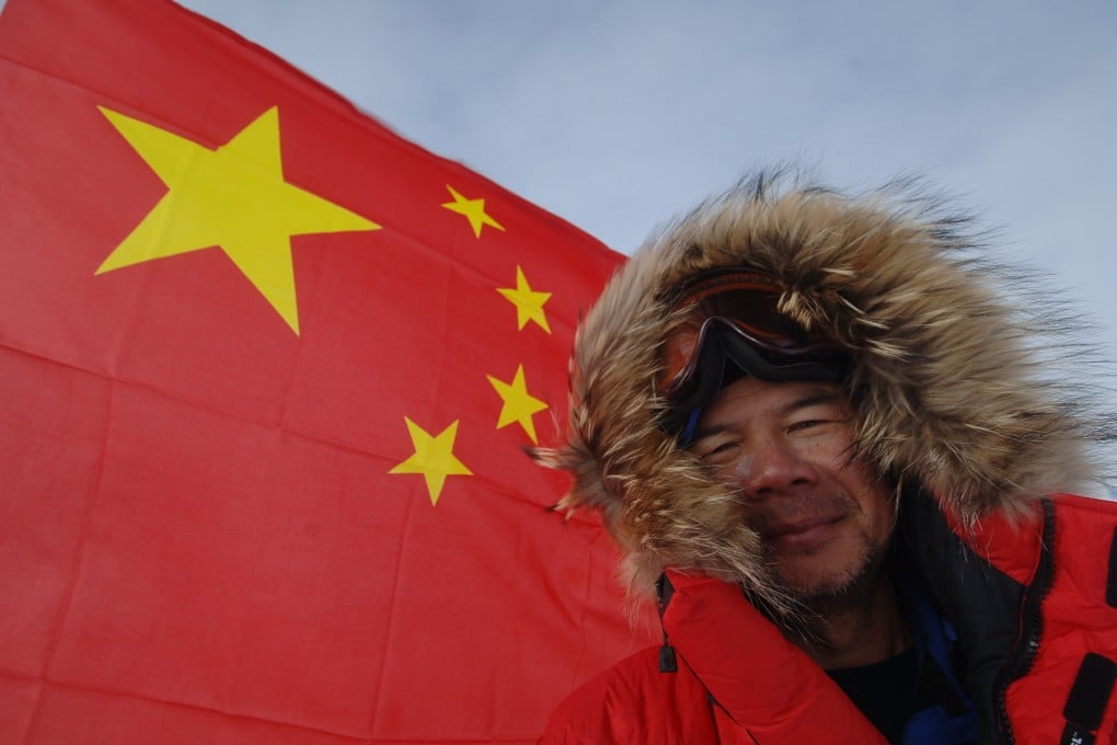 Hong Kong climber Chung Kin-man poses with the national flag after reaching the South Pole. The adventurer arrived back home on January 5, 2006 after completing the so-called “7+2” challenge – becoming the first Hongkonger and one of the first Chinese people to have reached the north and south poles and the highest peaks on seven continents. Photo: SCMP