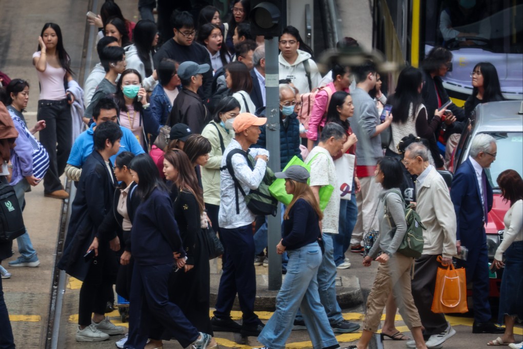 People walk through Central on December 19. A government health survey for 2020-22 showed 410,000 people in the city were living with hepatitis B. Photo: Dickson Lee