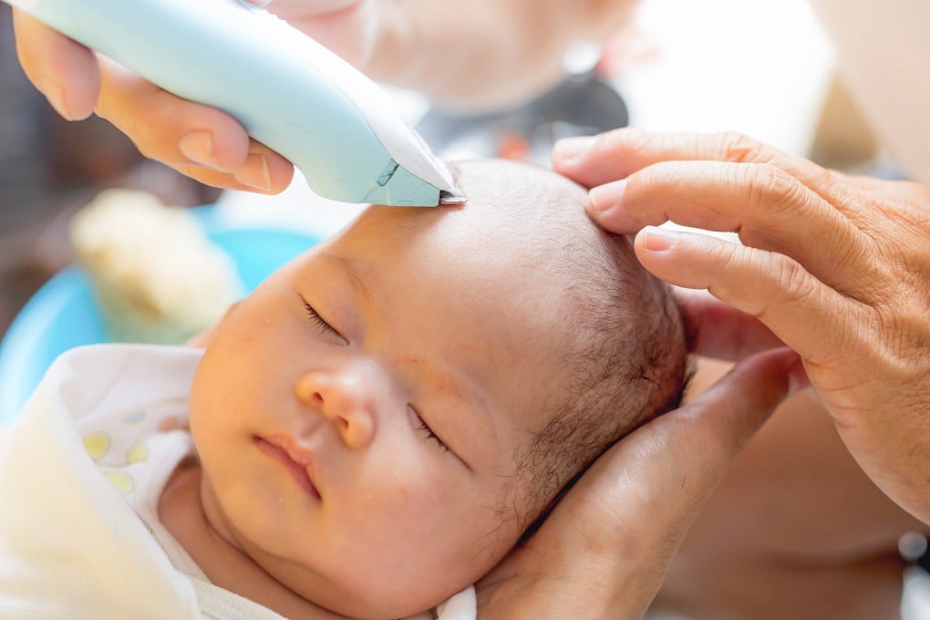 A traditional Chinese “hair-shaving” custom for newborns involves placing 12 stones, 12 coins, and 12 red eggs in water, symbolising intelligence and future success. Photo: Shutterstock