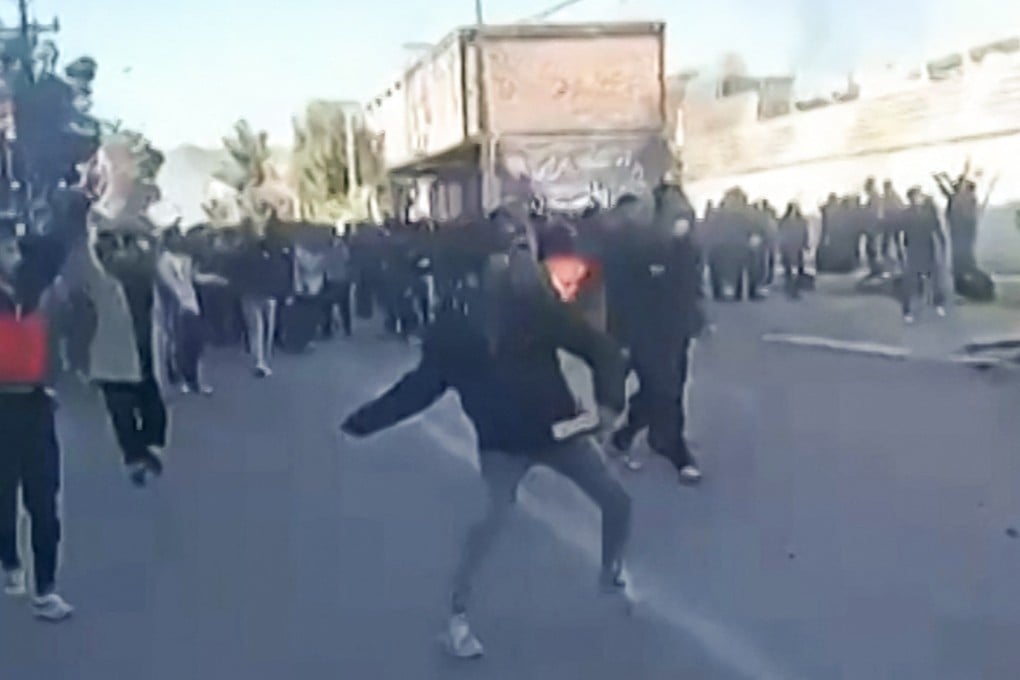 Protestors attacking a government building in Fasa, in southern Iran on December 31. Photo: Photo: UGC via AFP
