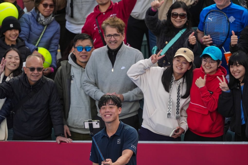 Coleman Wong taking selfies with supporters after winning his first-round match at the Hong Kong Open on Tuesday. Photo: Elson Li