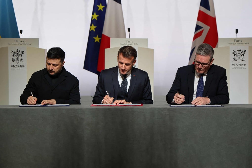 Ukraine’s President Volodymyr Zelensky (left) signs a declaration of intent along with France’s President Emmanuel Macron (centre) and UK Prime Minister Keir Starmer. Photo: AFP