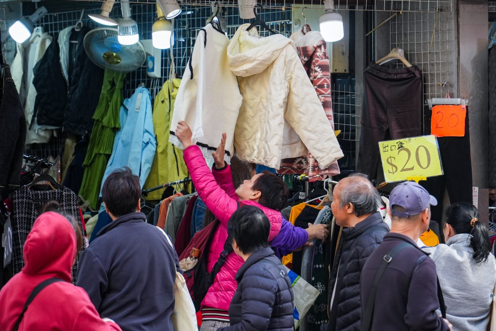 Hongkongers look for warm clothing to counter the cold weather. Photo: Eugene Lee