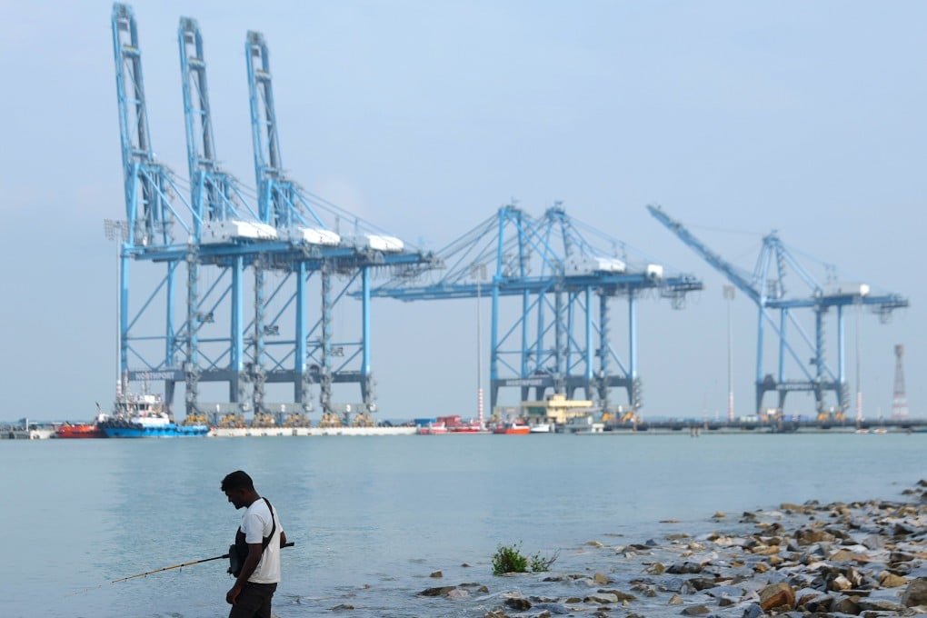 A man fishes in the maritime trading hub of Klang. Photo: EPA