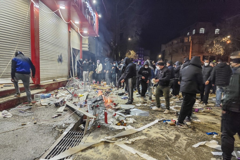 Iranians gather while blocking a street during a protest in Kermanshah, Iran on January 8. Photo: AFP