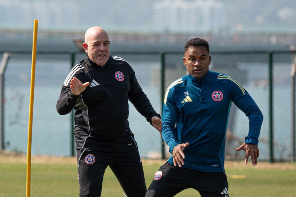 Manu Torres (left) issues instructions to winger Gil Martins as he gets to know the Eastern players during a training session in Tseung Kwan O. Photo: Eastern SC.