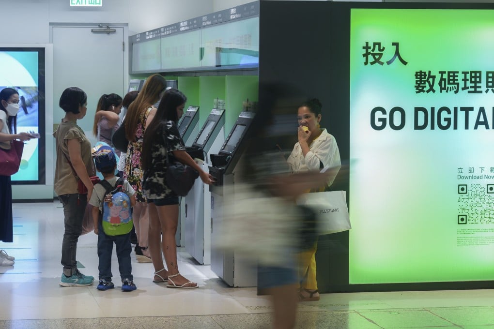 People use ATMs in Central in 2024. A 2025 survey found a majority of respondents reporting that digital banks could meet at least half of their daily banking needs. Photo: Eugene Lee
