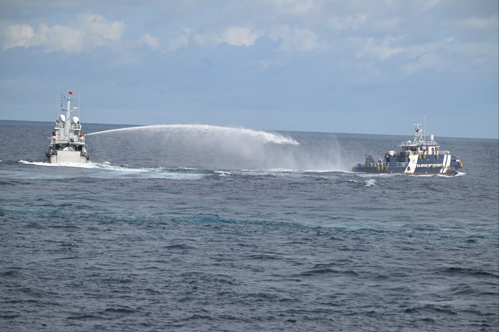 Chinese coast guards use a water cannon against a Philippine vessel in the South China Sea on October 12, 2025. Photo: China Coast Guard/Xinhua