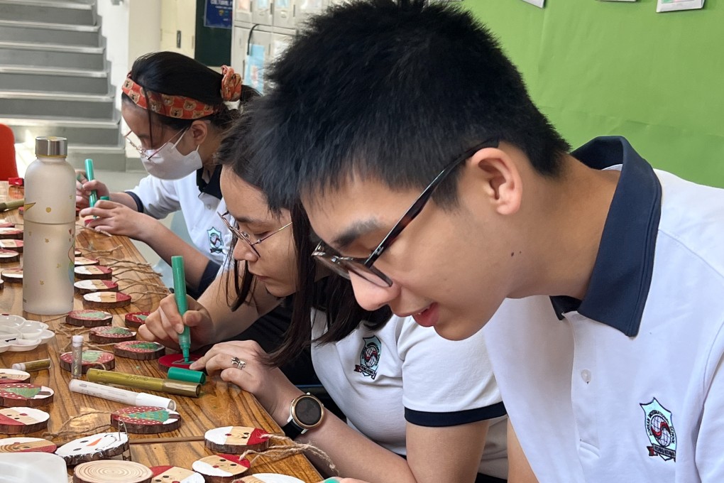 Korean International School students craft Christmas decorations for their school’s charity sale. Photo: Handout