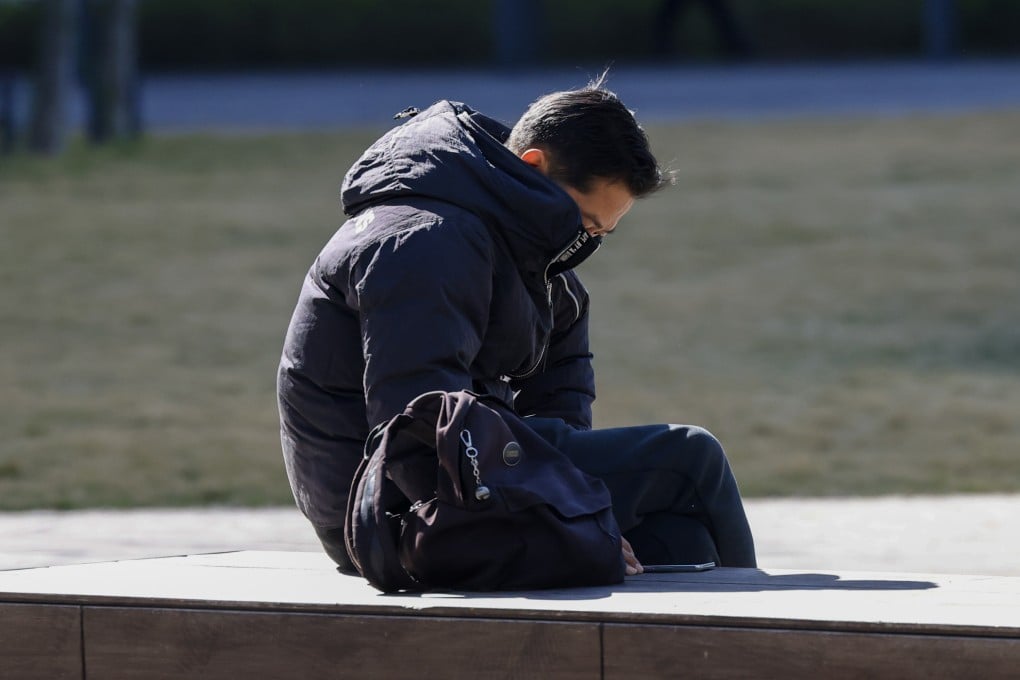 A man sits outside on a cold day in Hong Kong. SAD, or seasonal affective disorder, is triggered by extreme weather changes and less daylight in winter, making us feel, well, sad. Photo: Dickson Lee