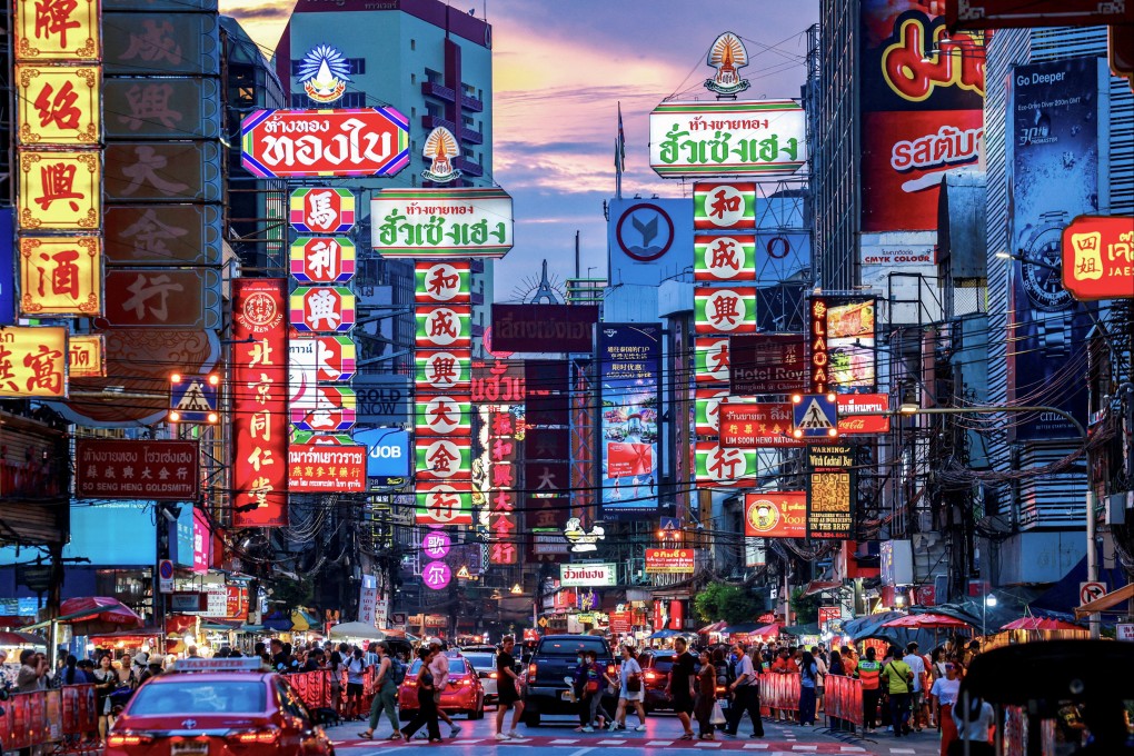 Tourists cross a busy street in Bangkok’s Chinatown. Chinese outbound tourism is expected to grow in 2026, with Thailand among the most popular destinations. Photo: Reuters