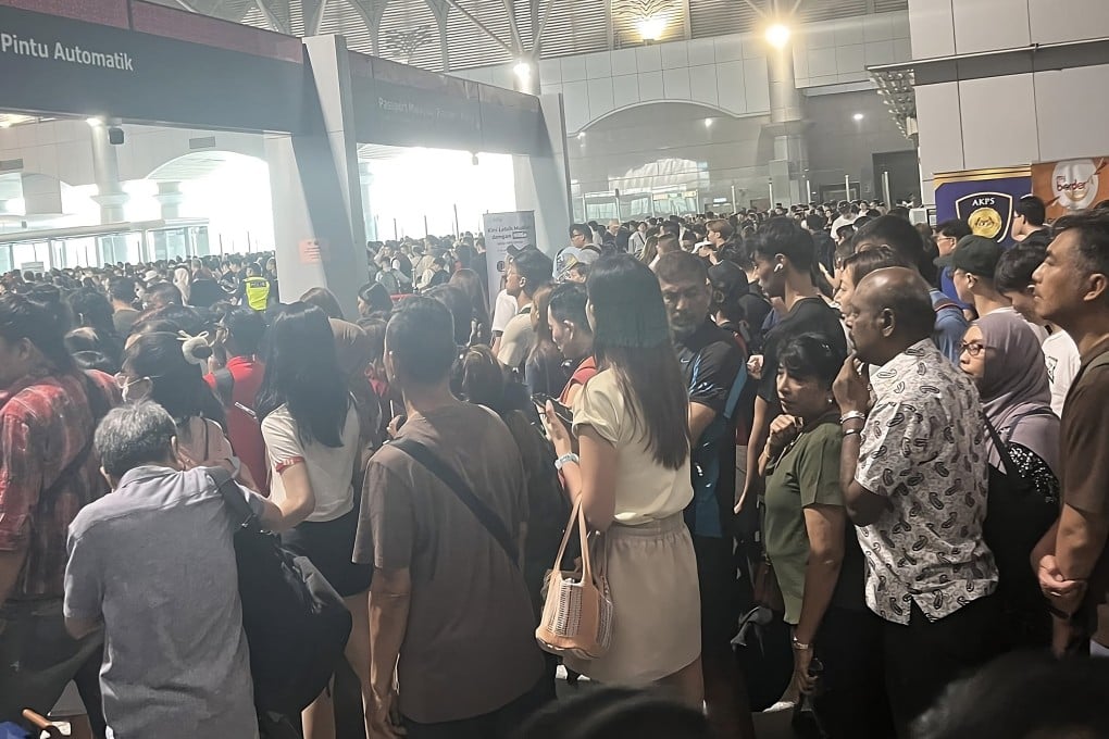 An image circulated on social media on Saturday shows a crowd of travellers waiting to pass through automated immigration gates at the Malaysia-Singapore border. Photo: Facebook