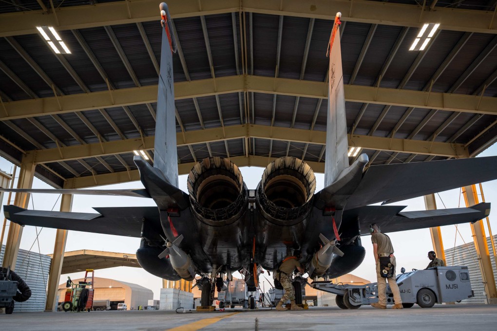 US airmen load GBU-31 munition systems onto an F-15E Strike Eagle in support of Operation Hawkeye Strike in December. Photo: US Air Force via AFP