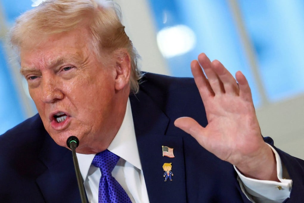 US President Donald Trump wears a “happy Trump” pin as he speaks during a meeting with oil industry executives at the White House on Friday. Photo: Reuters