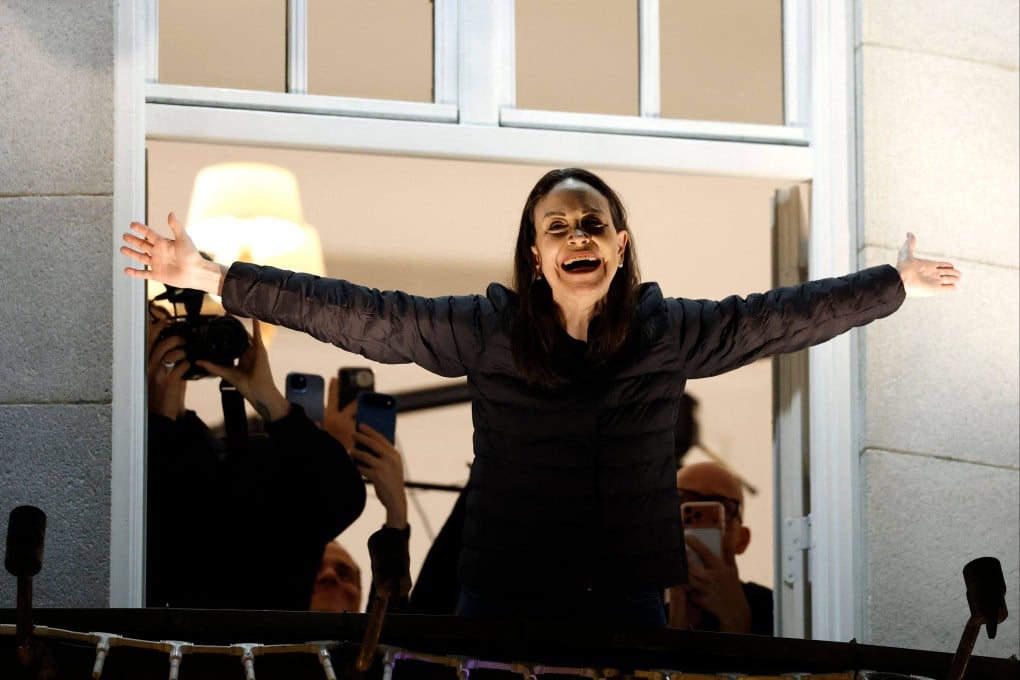 Nobel peace laureate Maria Corina Machado greets supporters from a balcony of a hotel in Oslo, Norway, last month. Photo: AFP