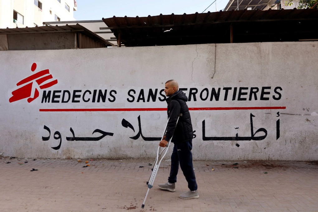 A Palestinian man walks on his crutches to the Doctors Without Borders or Medecins Sans Frontieres (MSF) clinic, in the al-Rimal neighbourhood of Gaza City on new year’s eve. Photo: AFP