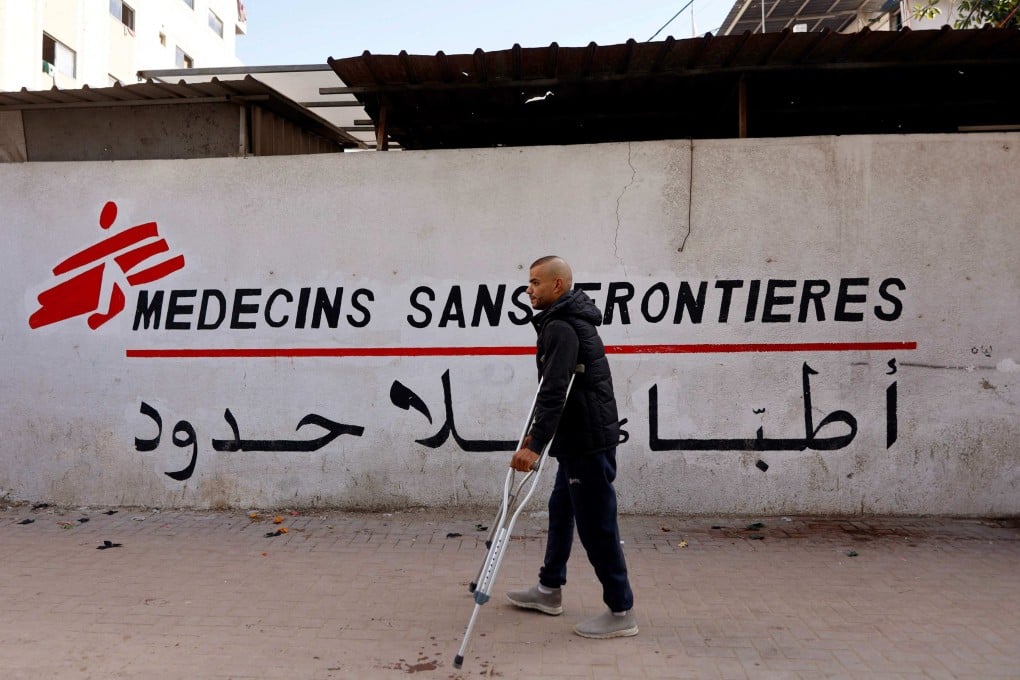 A Palestinian man walks on his crutches to the Doctors Without Borders or Medecins Sans Frontieres (MSF) clinic, in the al-Rimal neighbourhood of Gaza City on new year’s eve. Photo: AFP