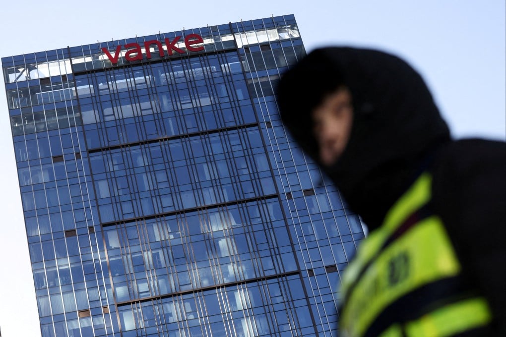A security guard stands near a development by Vanke in Beijing on December 23, 2025. Photo: Reuters
