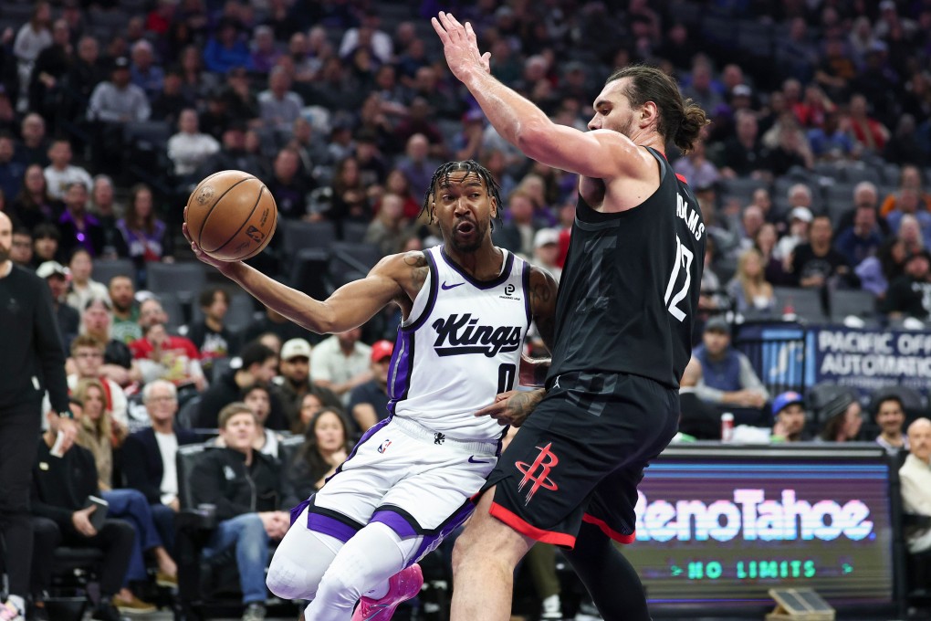 Sacramento Kings guard Malik Monk (left) looks to pass around Houston Rockets centre Steven Adams during their NBA encounter on Sunday. Photo: AP