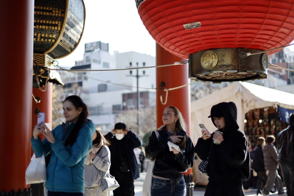 Foreign tourists visit a temple in Tokyo, Japan, last month. Photo: EPA