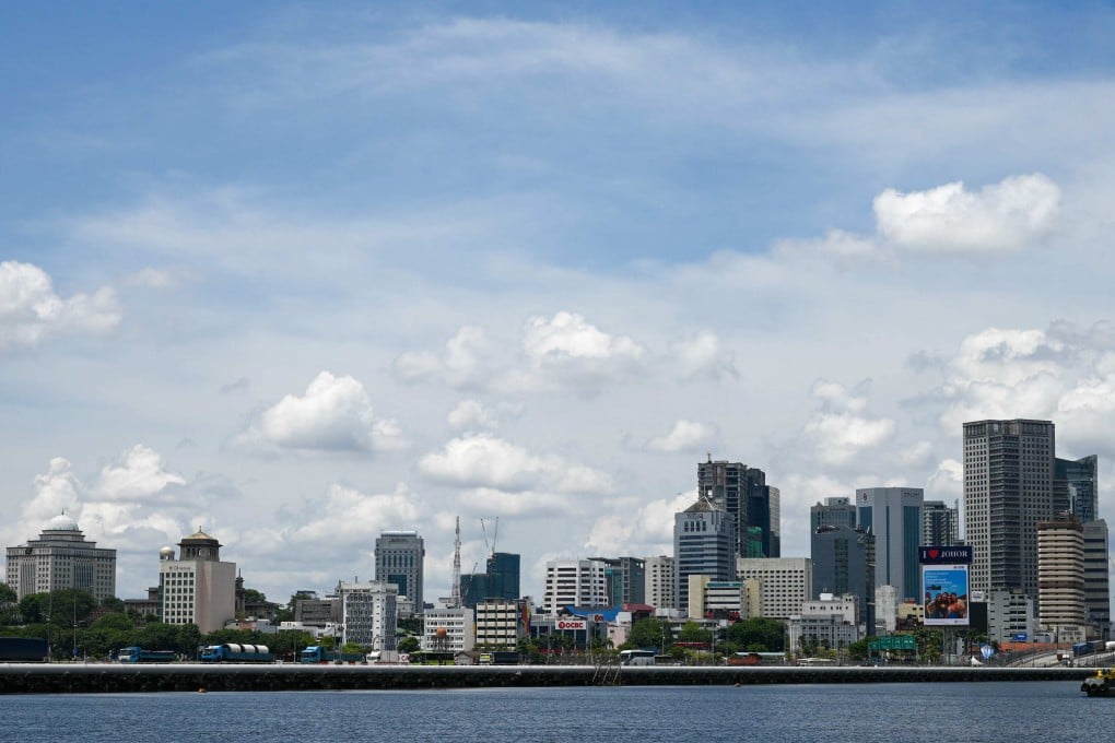 Vehicles travel across the causeway linking Malaysia’s southern Johor state to Singapore on Friday. Photo: AFP