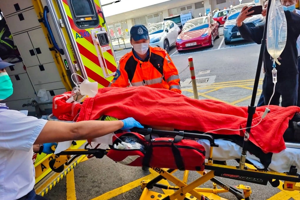 One of the injured workers is wheeled into an ambulance after being struck by gas cylinders at the Po Fung Road construction site. Photo: Handout