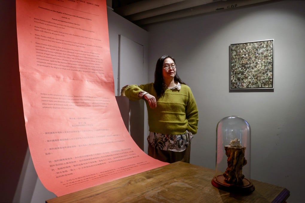Sophie Cheung poses among works at her “Decolonising Madness: The Naturally (In)complete Human” exhibition, which runs at Eaton HK until February 1. Photo: Jonathan Wong