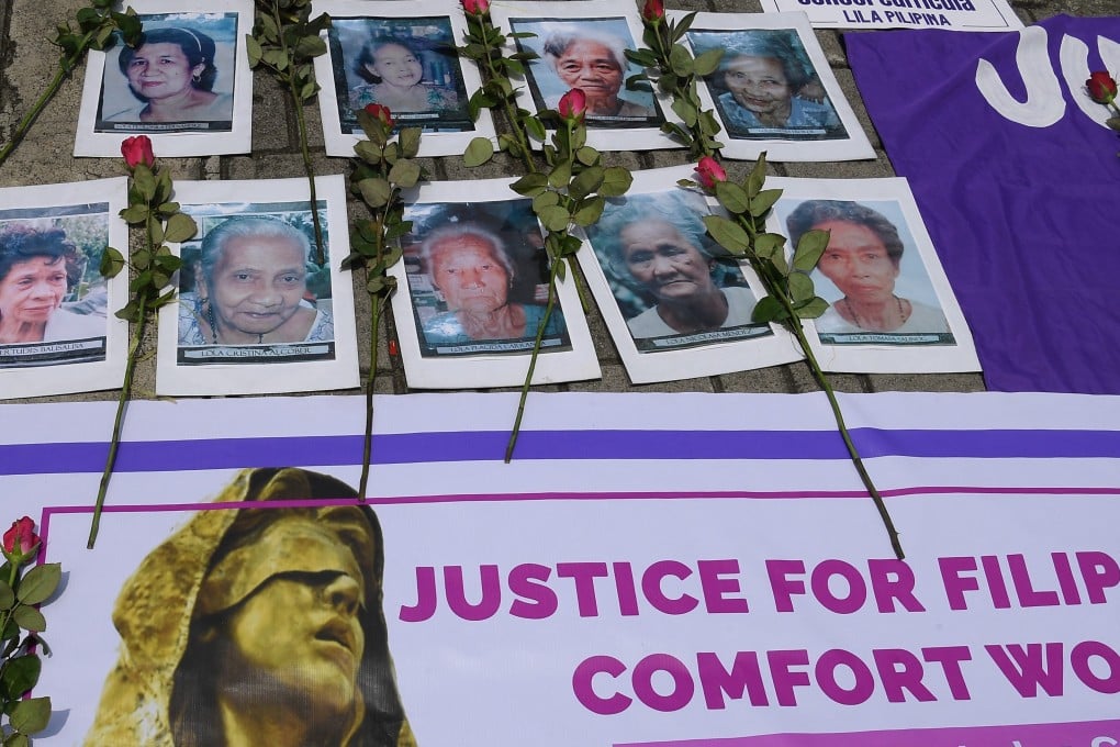 Protesters display placards and portraits of former Filipino “comfort women” during a rally in Manila last year. Photo: AFP