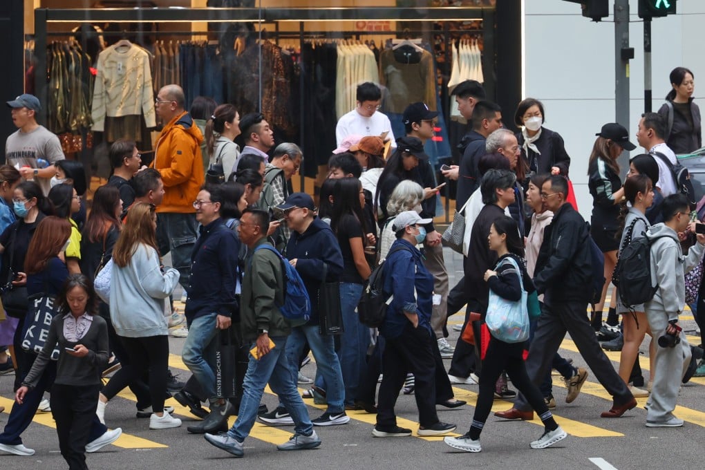 People crossing a street in Central on December 19, 2025. Scammers stole millions from Hongkongers in the first week of 2026. Photo: Dickson Lee