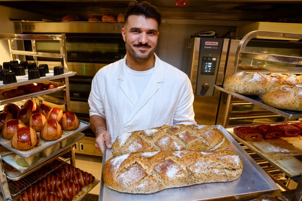 Social Goods founder Chris Younes holds a tray of sourdough loaves at the new bakery and cafe in Central, Hong Kong Island, on January 8, 2026. Photo: Jonathan Wong
