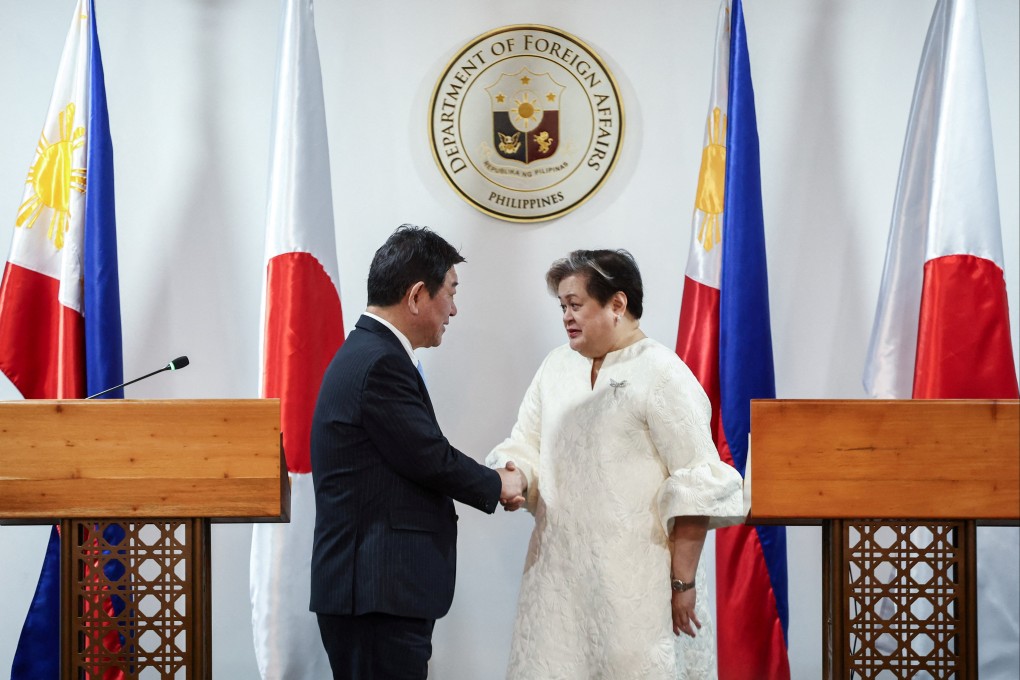 Japanese Foreign Minister Toshimitsu Motegi (left) and Philippine Foreign Secretary Theresa Lazaro shake hands after their joint press conference in Pasay City, Metro Manila, on Thursday. Photo: Reuters