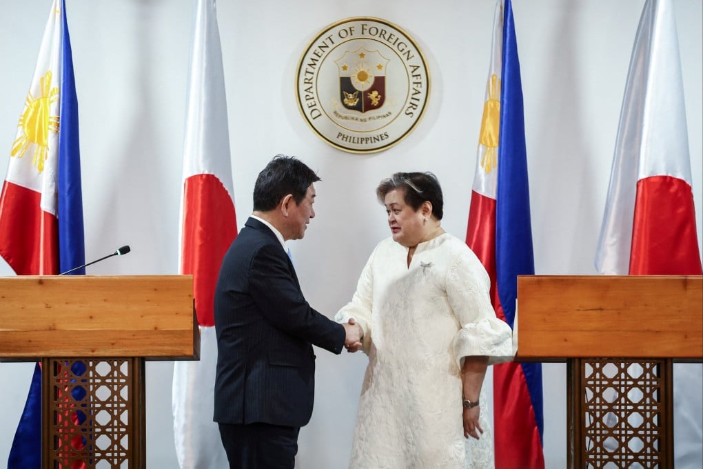 Japanese Foreign Minister Toshimitsu Motegi (left) and Philippine Foreign Secretary Theresa Lazaro shake hands after their joint press conference in Pasay City, Metro Manila, on Thursday. Photo: Reuters
