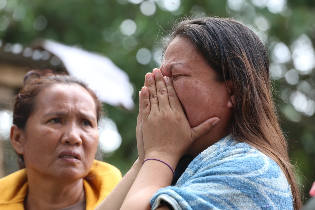 Family members of missing workers react as rescue operations continue at a collapsed landfill in Binaliw, Cebu, Philippines, on January 11. Photo: AP